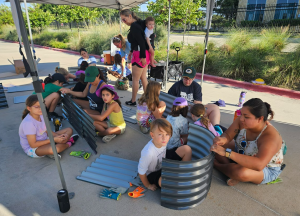 Parents and students volunteering together at NYOS Charter School